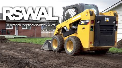 grading yard with skid steer|grading driveway with skid steer.